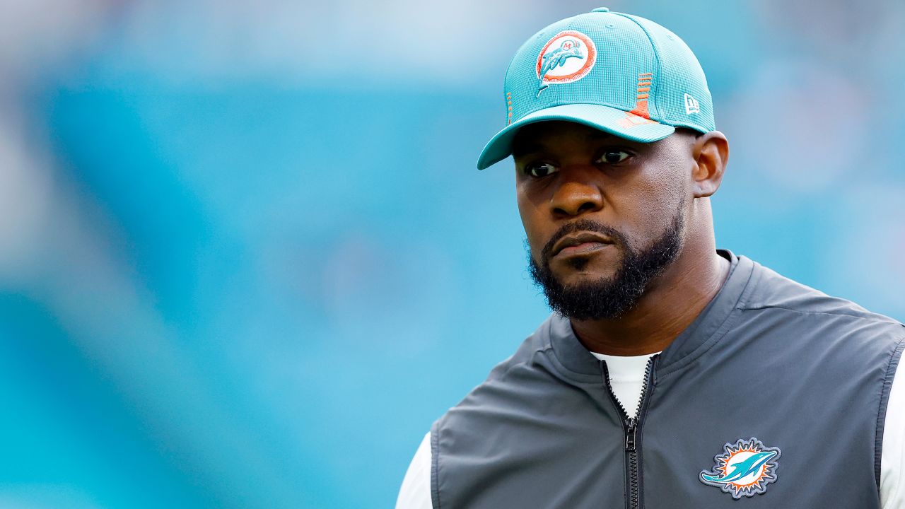 Brian Flores, then head coach of the Miami Dolphins, walks the field prior to the game against the New England Patriots in Miami on January 9, 2022.