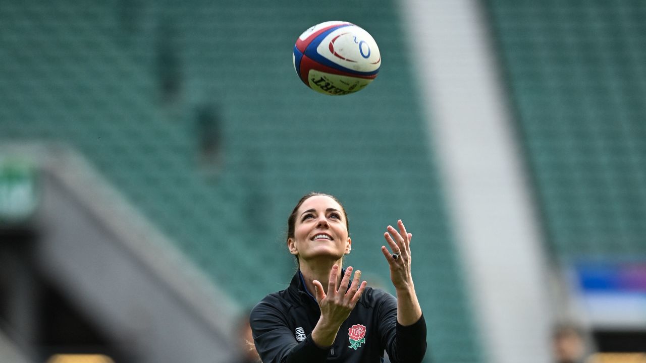 The Duchess of Cambridge plays with a rugby ball as she attends England's rugby teams' training sessions in London on February 2, 2022.
