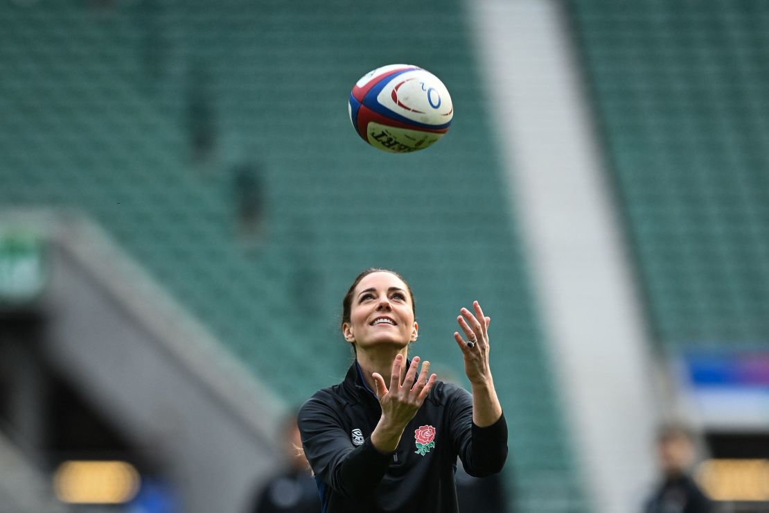 The Duchess of Cambridge plays with a rugby ball as she attends England's rugby teams' training sessions in London on February 2, 2022.