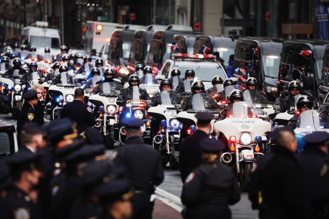 Police officers gather for Mora's funeral. 