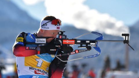 Johannes Thingnes Bø competes at the shooting range during the men's 4x7.5 km relay event of the IBU Biathlon World Cup in Hochfilzen, Austria, on December 12, 2021. 
