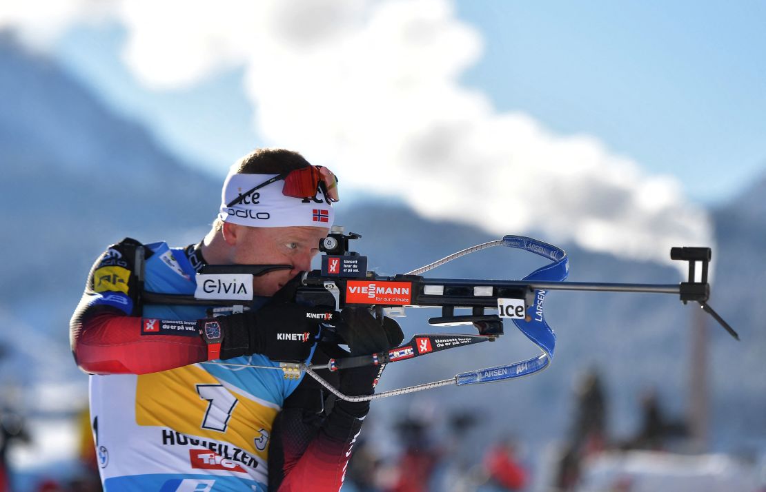Johannes Thingnes Bø competes at the shooting range during the men's 4x7.5 km relay event of the IBU Biathlon World Cup in Hochfilzen, Austria, on December 12, 2021. 