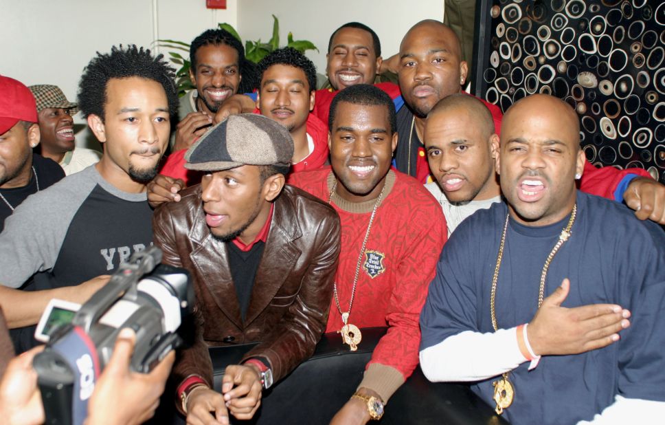 West, at center in red, hangs out with some famous friends in the music industry, including John Legend, Mos Def, Consequence and Damon Dash, after a performance in New York in 2003. West's first studio album, "The College Dropout," released in February 2004.