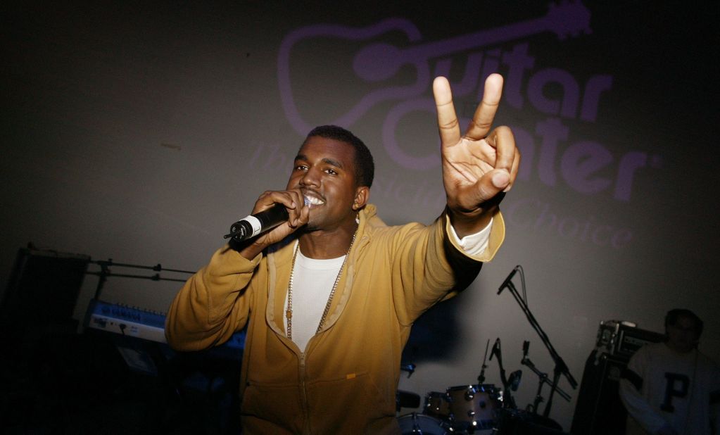 West gives a peace sign as he performs at an event in New York in 2003.
