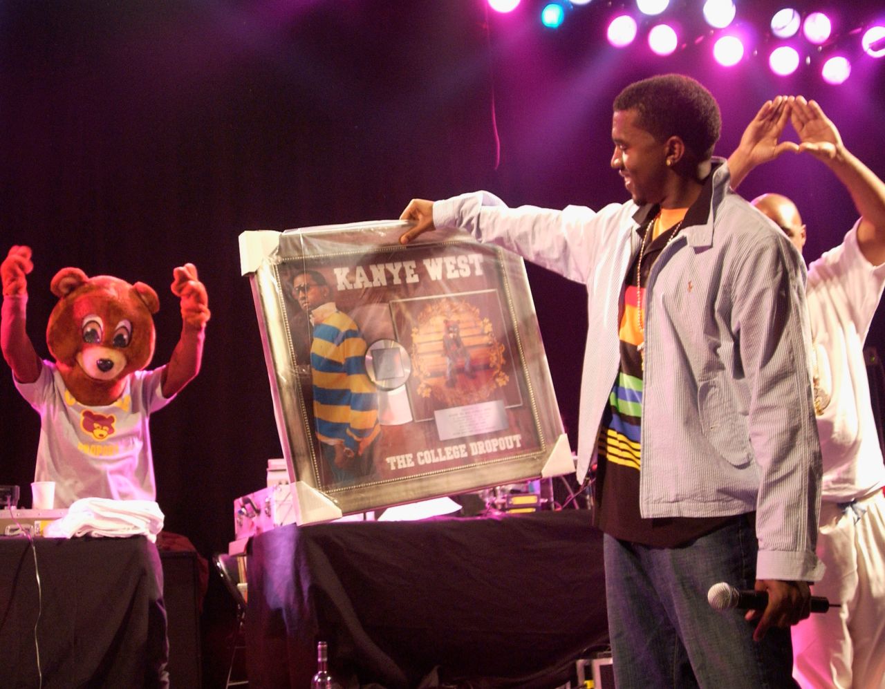West is presented with his first platinum album for "The College Dropout" in 2004. The critically acclaimed album included hits such as "Through the Wire," "Jesus Walks" and "Slow Jamz." 