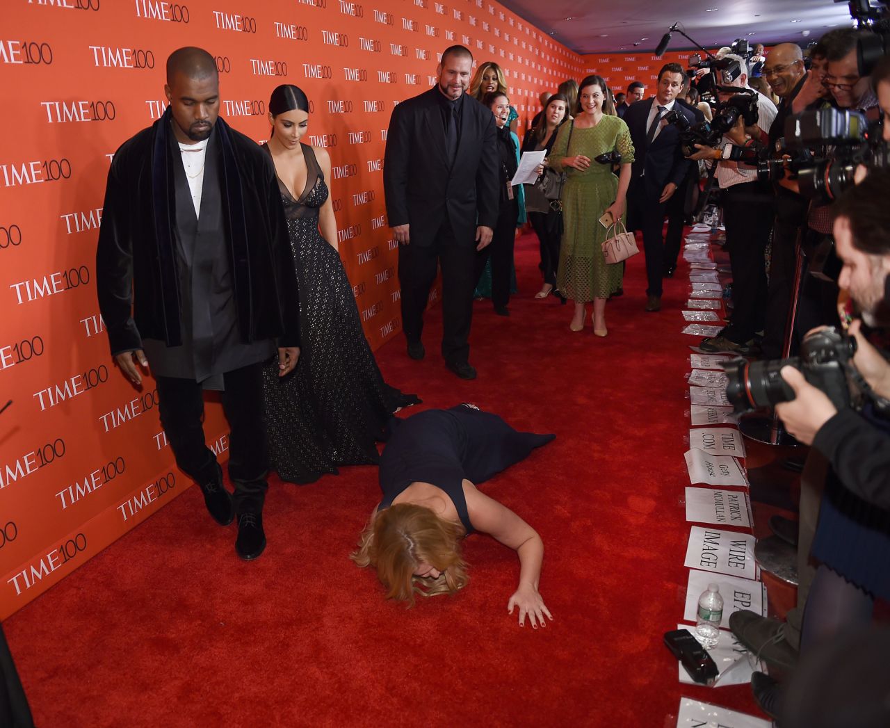 Comedian Amy Schumer pretends to <a href="https://www.cnn.com/2015/04/22/entertainment/amy-schumer-moment-feat/index.html" target="_blank">trip and fall</a> in front of West and Kardashian West as they attend the Time 100 Gala in 2015.