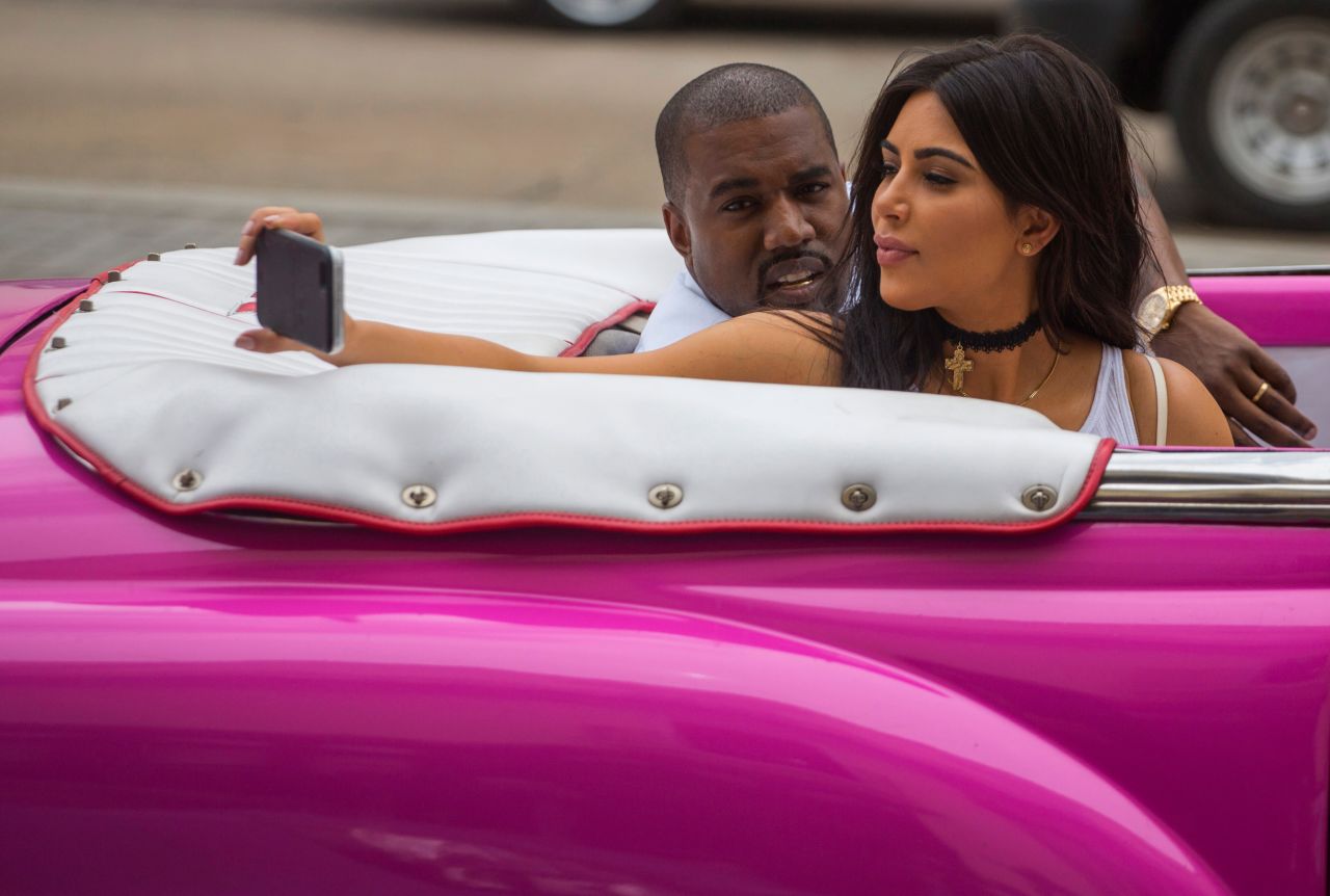 Kardashian West takes a selfie as she rides in a classic car with her husband in Havana, Cuba, in 2016. 
