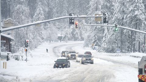 A vehicle is stuck in the snow during a winter storm on December 27 in Grass Valley, California.