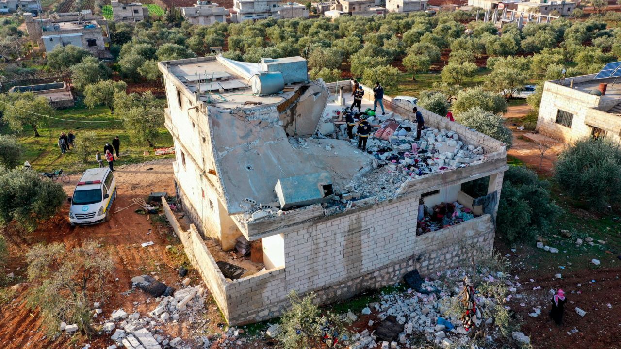 People inspect a destroyed house following an operation by the U.S. military in the Syrian village of Atmeh, in Idlib province, Syria, Thursday, Feb. 3, 2022. U.S. special operations forces conducted a large-scale counterterrorism raid in northwestern Syria overnight Thursday, in what the Pentagon said was a "successful mission." Residents and activists reported multiple deaths including civilians from the attack. (AP Photo/Ghaith Alsayed)