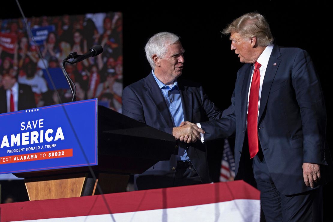 Former President Donald Trump welcomes candidate for US Senate and Rep. Mo Brooks to the stage during a rally at York Family Farms in August 2021 in Cullman, Alabama.