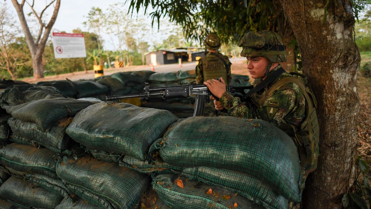 Colombian military forces guard a national highway in Arauca, Colombia on January 22, 2022. 
