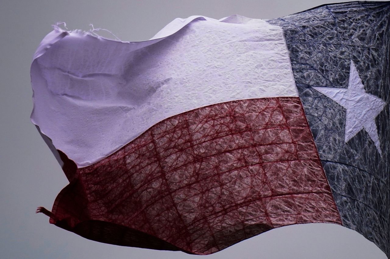 Ice begins to form on a Texas flag in San Antonio.
