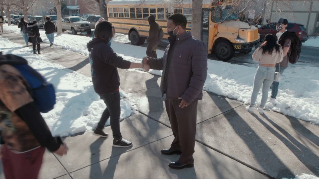 Principal Simmons checks in with students as they arrive each morning.