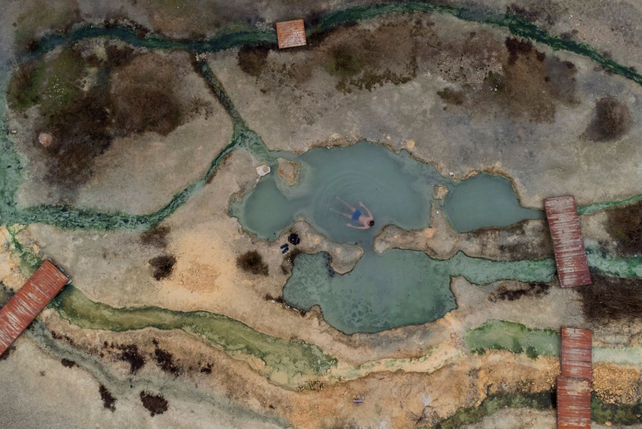 A man enjoys hot waters at a natural mineral spring near the Bulgarian village of Rupite on Wednesday, February 2.