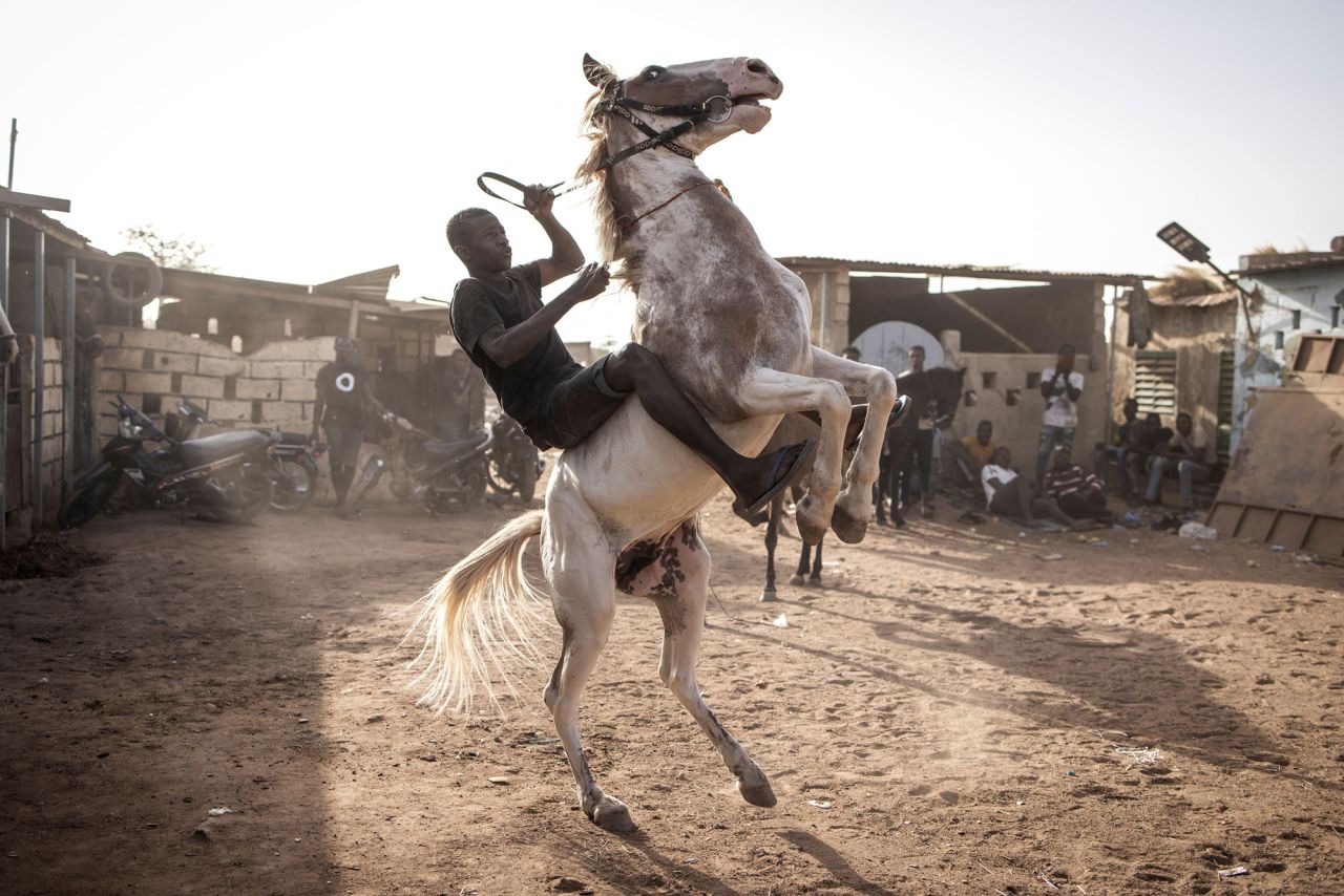 A jockey practices with his horse in Ouagadougou, Burkina Faso, on Tuesday, February 1.