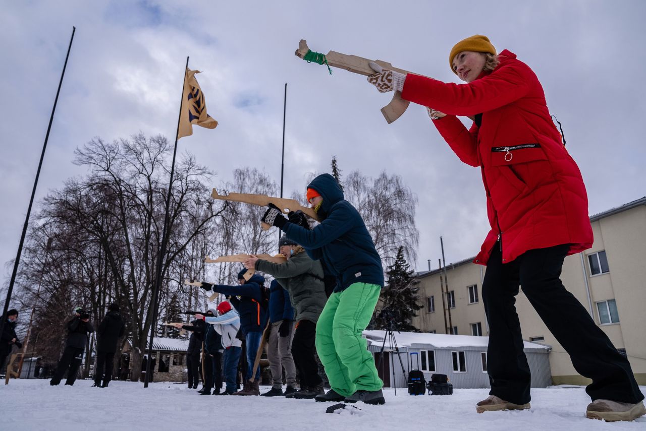 Civilians use wooden mock rifles as they learn combat tactics in Kyiv, Ukraine, on Sunday, January 30. With the looming threat of a Russian invasion, more Ukrainians are taking up arms and <a href="https://www.cnn.com/2022/02/01/europe/gallery/ukraine-russia-training-fadek/index.html" target="_blank">learning how to fight.</a>