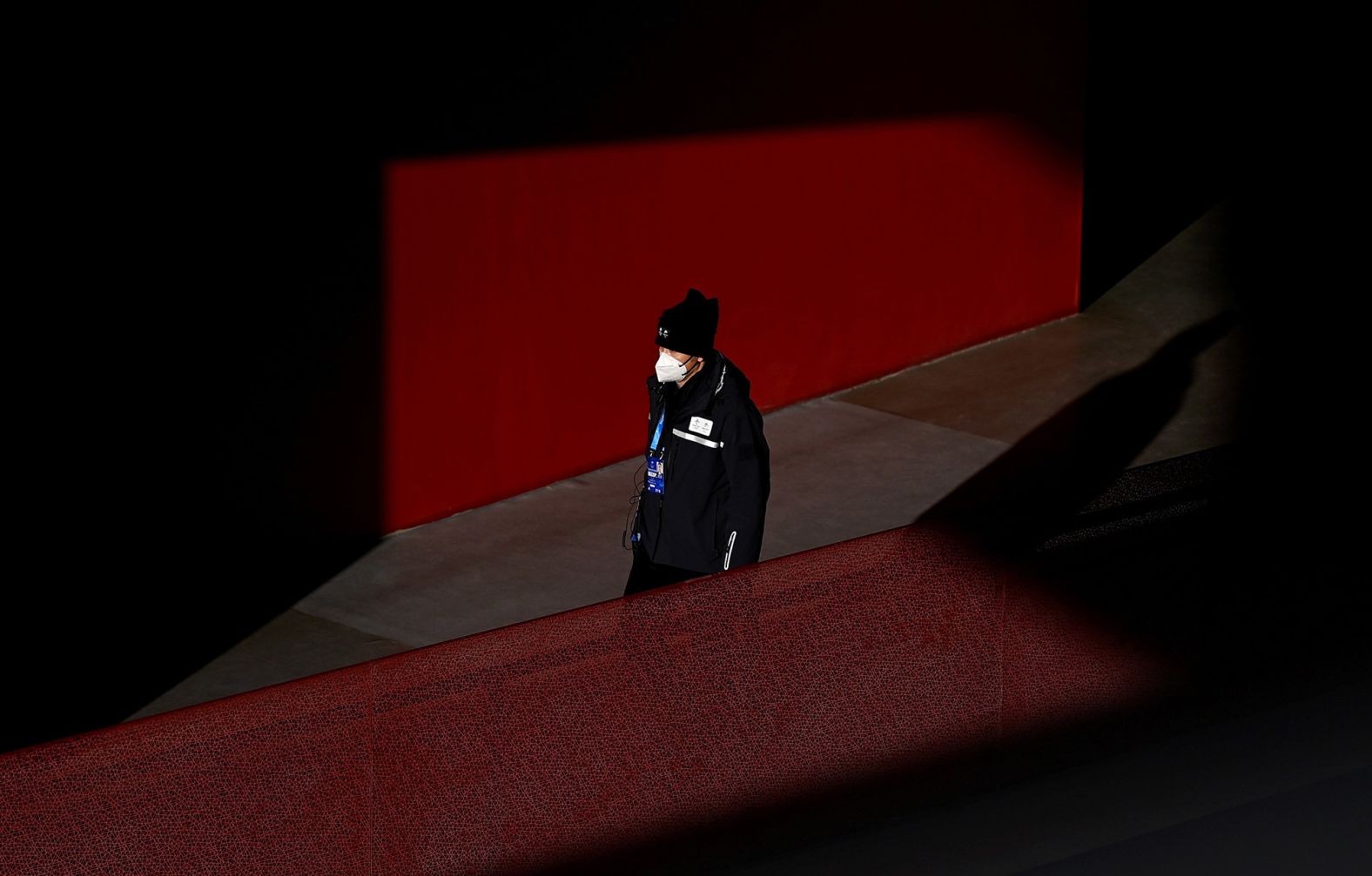 A security guard walks through the stadium.