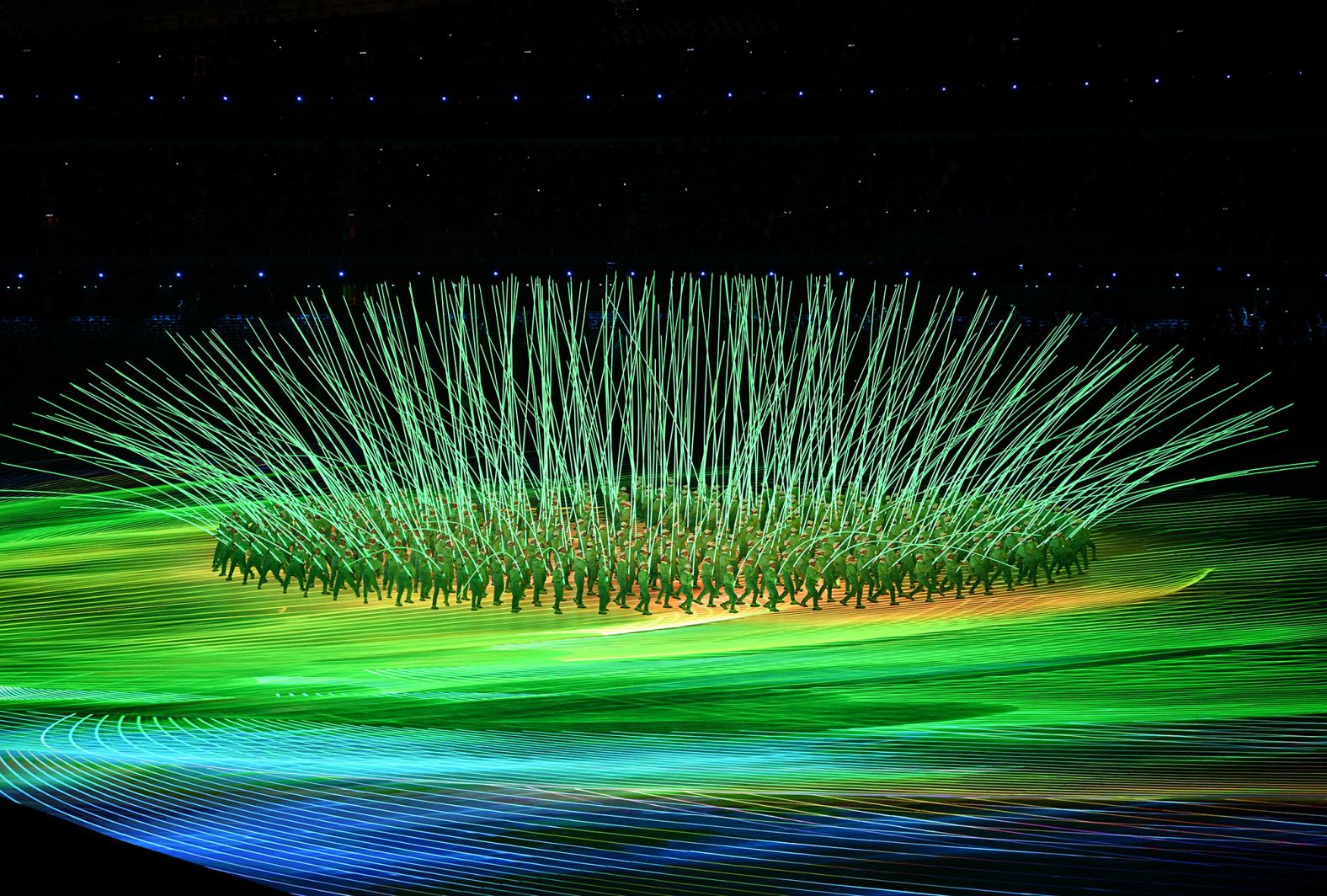 Performers create a flower display with LED lights during the opening ceremony.