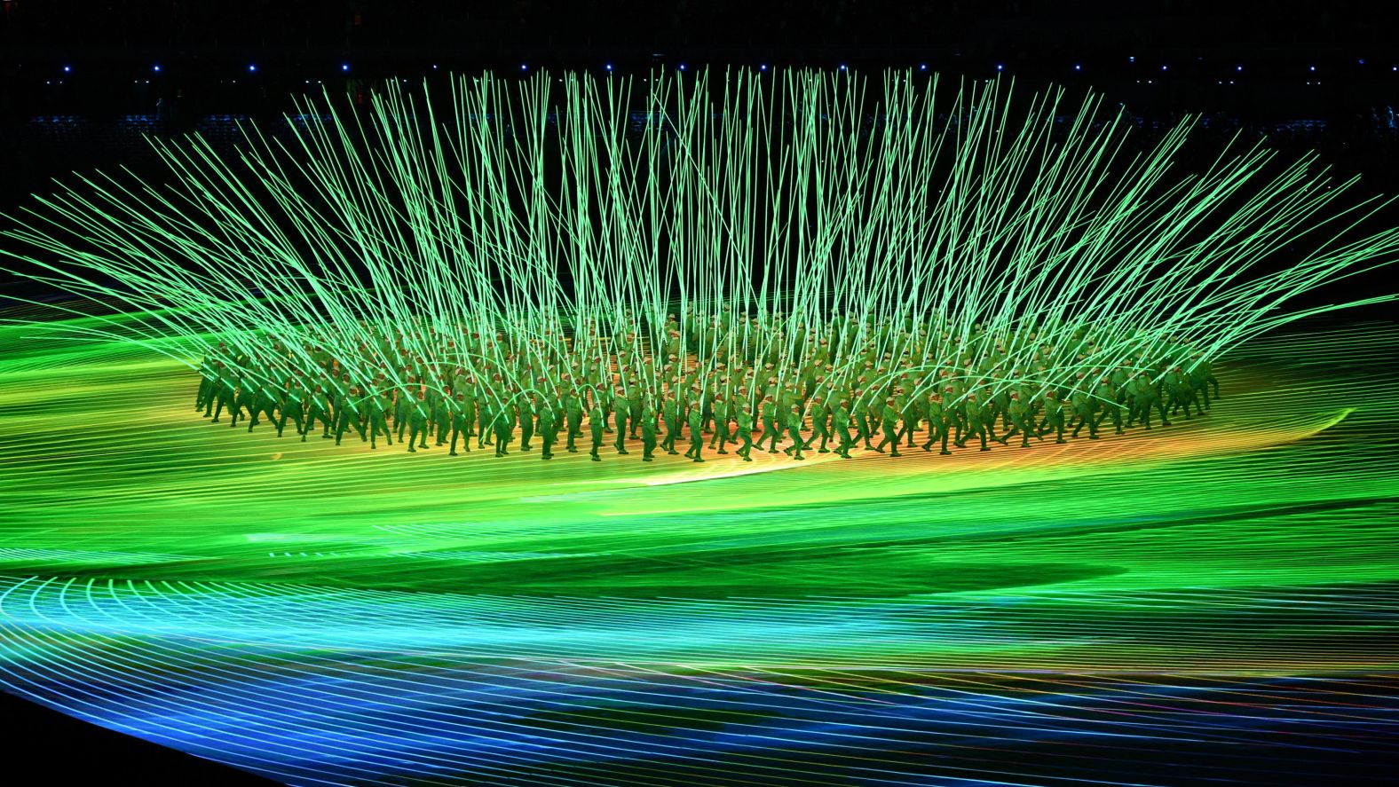 Performers create a flower display with LED lights during the opening ceremony.