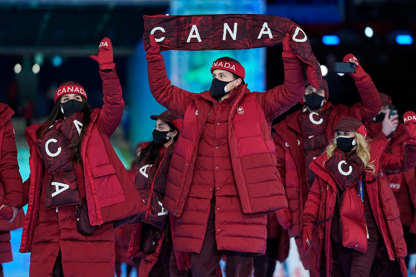 Athletes from Canada walk into the stadium during the parade of nations.