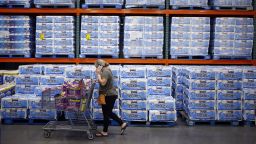 A customer pushes a shopping cart past pallets of toilet paper at a Costco Wholesale Corp. store in Louisville, Kentucky, U.S., on Wednesday, May 29, 2019. 