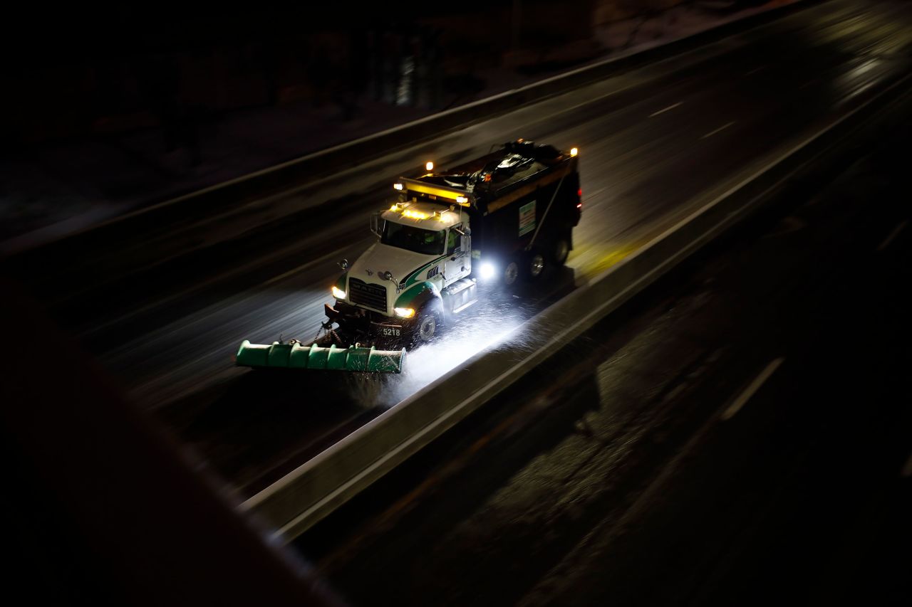 A snow plow travels down Interstate 64 in Louisville, Kentucky, on February 3.