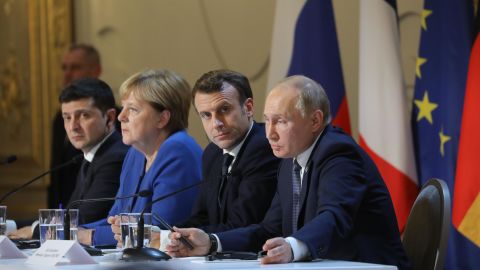 Ukrainian President Volodymyr Zelensky, then-German Chancellor Angela Merkel, Macron and Putin give a press conference after a summit on Ukraine at the Elysee Palace in Paris on December 9, 2019.