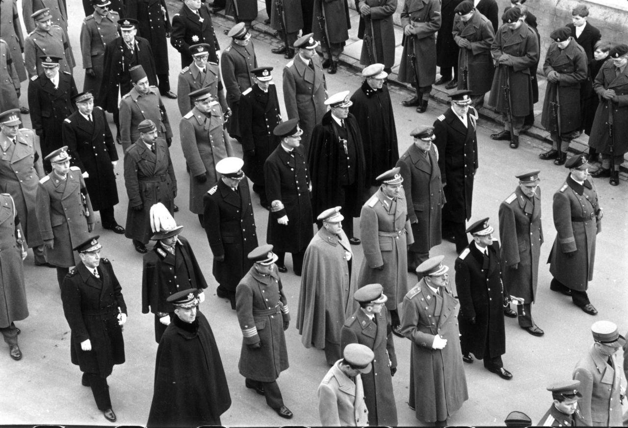 Foreign heads of state and their representatives march in the King's funeral procession.