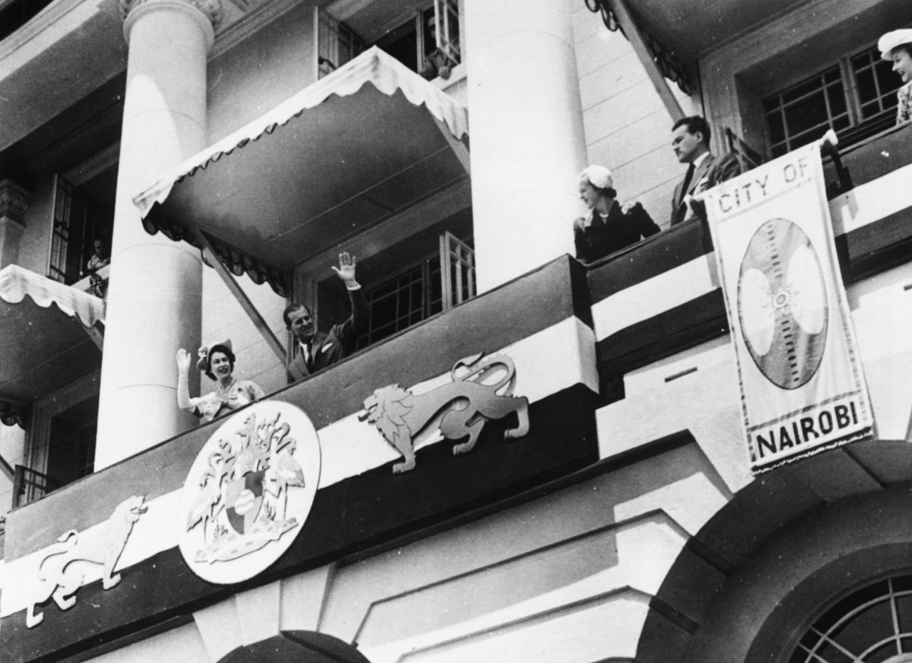 Princess Elizabeth and Prince Philip wave to Kenyans from the balcony of Nairobi's City Hall on February 4, 1952. 
