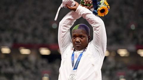 Second-placed USA's Raven Saunders gestures on the podium with her silver medal after competing the women's shot put event during the Tokyo 2020 Olympic Games at the Olympic Stadium in Tokyo on August 1, 2021. 