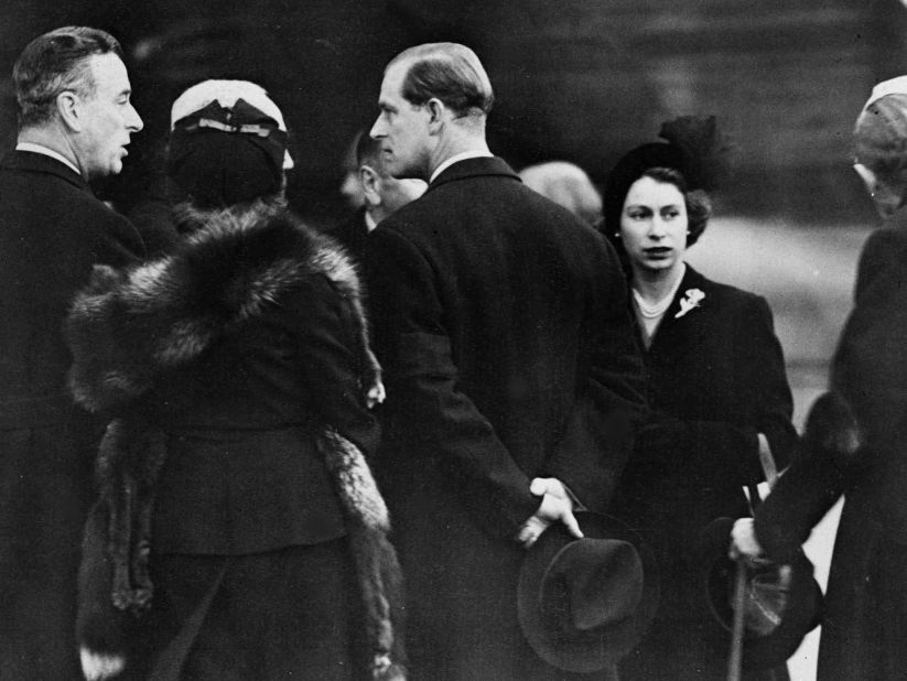 Elizabeth and Philip are greeted on their arrival in London.