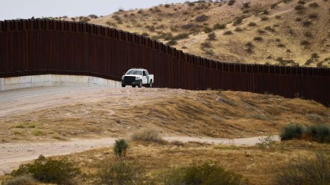 A US Border Patrol vehicle sits next to a border wall in the El Paso Sector along the US-Mexico border between New Mexico and Chihuahua state on December 9, 2021 in Sunland Park, New Mexico. 