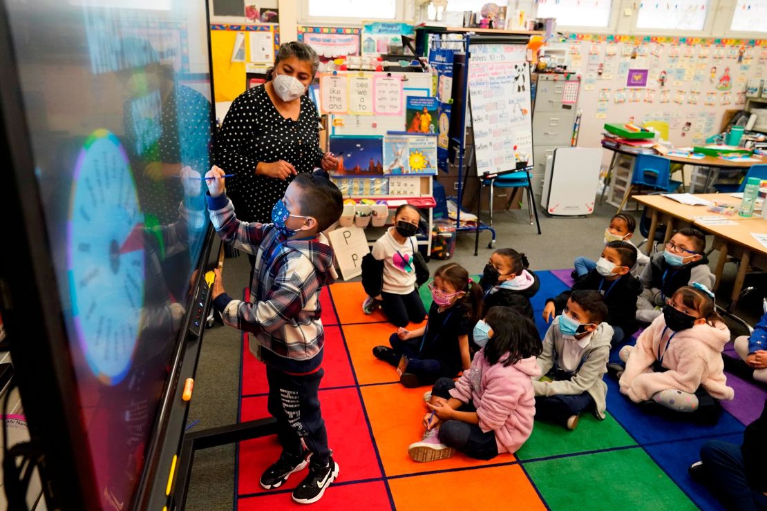 A kindergarten teacher instructs students at a Lynwood, California, elementary school on January 12, 2022.