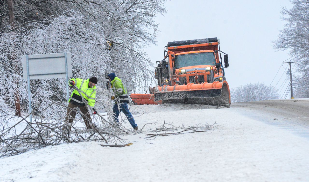 Crews from the New Hampshire Department of Transportation remove debris from a fallen tree near Chesterfield on Friday, February 4.