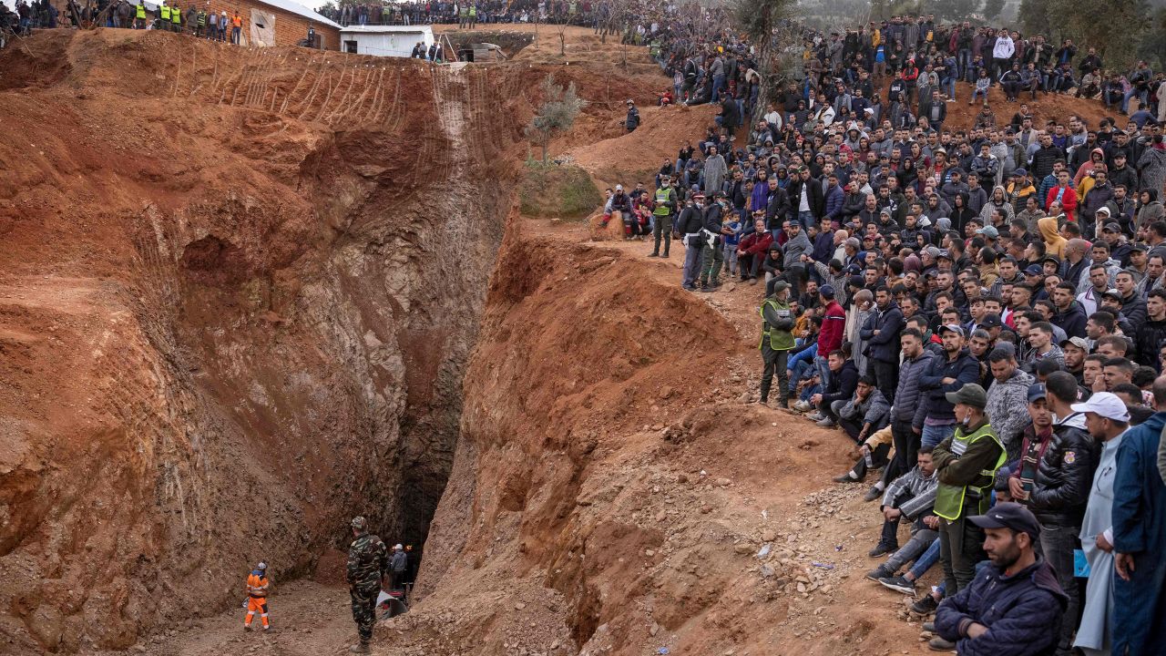 Bystanders watch as Moroccan emergency teams work to rescue 5-year-old boy Rayan from a well shaft on February 4.