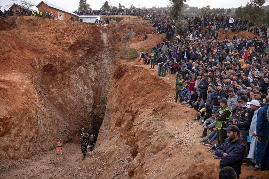 Bystanders watch as Moroccan emergency teams work to rescue 5-year-old boy Rayan from a well shaft on February 4.