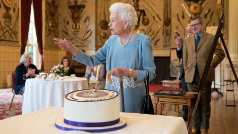 Guests gathered at the Queen's countryside residence to celebrate her historic milestone with cake. 