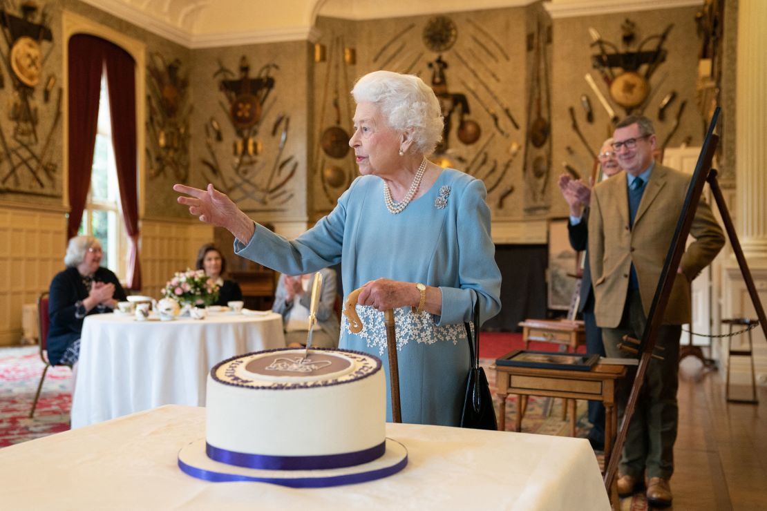 Guests gathered at the Queen's countryside residence to celebrate her historic milestone with cake. 