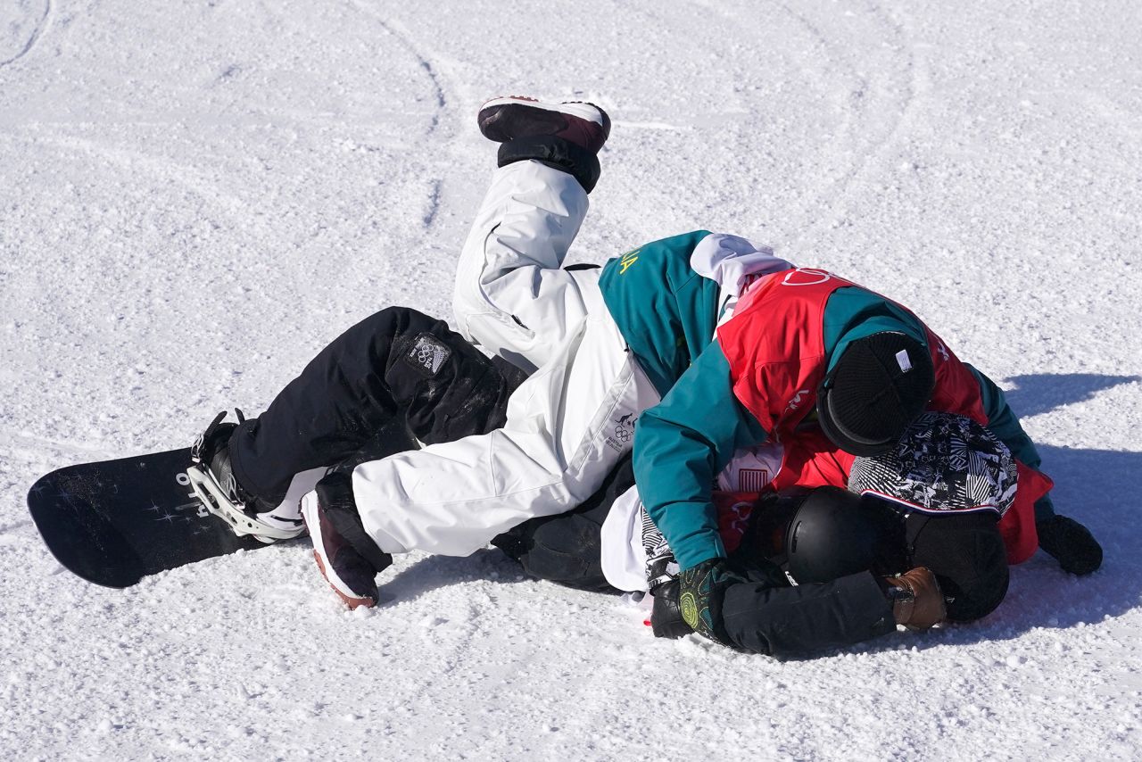 New Zealand snowboarder Zoi Sadowski-Synnott, bottom, is tackled by the United States' Julia Marino and Australia's Tess Coady after her final slopestyle run on February 6. Sadowski-Synnott <a href="https://www.cnn.com/world/live-news/beijing-winter-olympics-02-06-22-spt/h_313bd248a76b7d0101ec6b03c5aa9160" target="_blank">made history</a> by winning her country's first-ever gold in the Winter Olympics. Marino won the silver and Coady won the bronze.