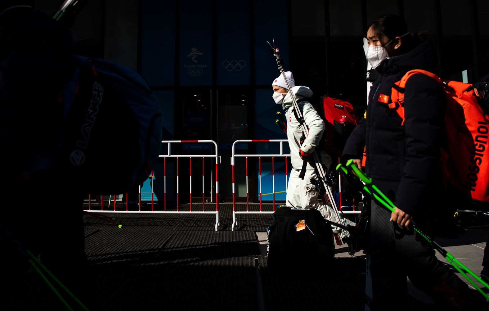 Skiers leave the Yanqing National Alpine Skiing Center after <a href="https://www.cnn.com/world/live-news/beijing-winter-olympics-02-06-22-spt/h_1af54ca403dafee46143bcbde4525833" target="_blank">the men's downhill was postponed</a> due to high winds on February 6.