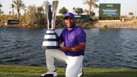 Varner poses for a photo with the trophy after winning the Saudi International.
