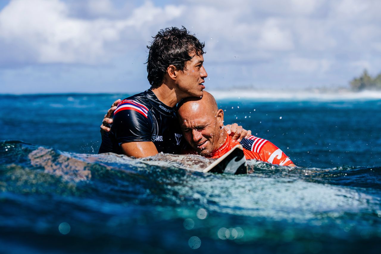 Surfing great Kelly Slater, right, embraces fellow competitor Seth Moniz after <a href="https://www.cnn.com/2022/02/06/sport/kelly-slater-surfing/index.html" target="_blank">Slater won the Billabong Pro Pipeline in Hawaii</a> on Saturday, February 5. It was just days shy of Slater's 50th birthday.