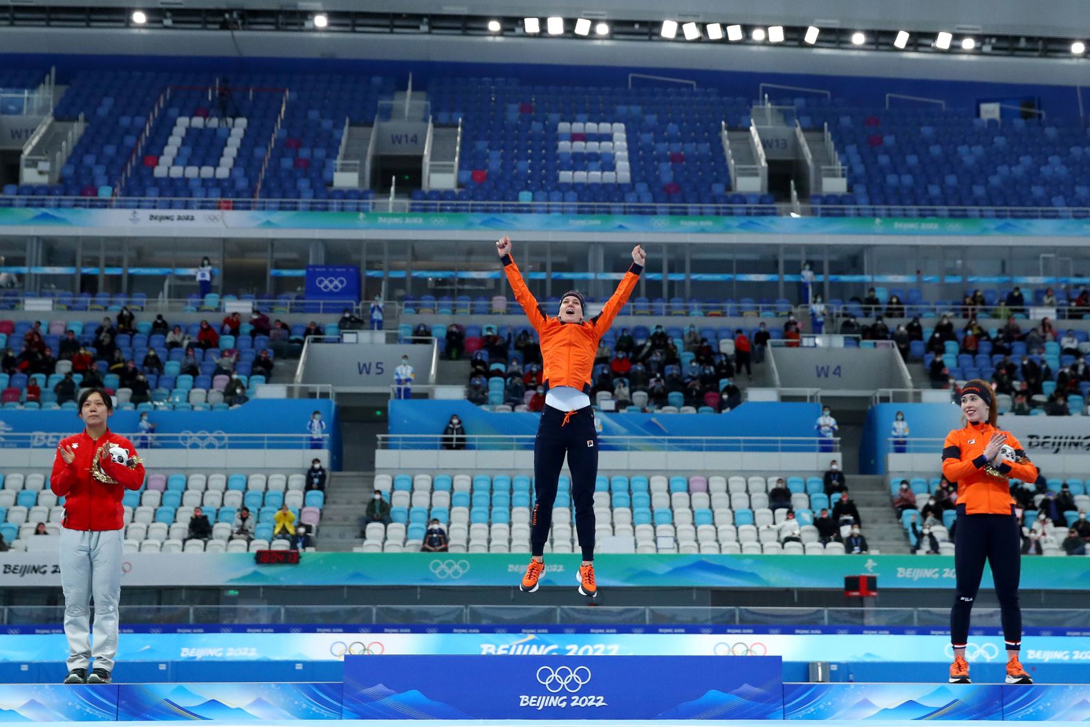 Dutch speedskater Ireen Wüst celebrates on the podium after winning the 1,500 meters on February 7. The 35-year-old became the<a href="index.php?page=&url=https%3A%2F%2Fwww.cnn.com%2Fworld%2Flive-news%2Fbeijing-winter-olympics-02-07-22-spt%2Fh_2fde42a29ea625da70e0c68580fcb73e" target="_blank"> first athlete to win an individual gold medal in five separate Olympics.</a>