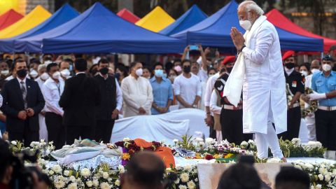 India's Prime Minister Narendra Modi (R) attends the state funeral ceremony of late Bollywood singer Lata Mangeshkar who died in Mumbai on February 6, 2022.
