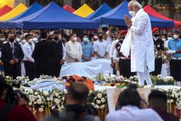 India's Prime Minister Narendra Modi (R) attends the state funeral ceremony of late Bollywood singer Lata Mangeshkar who died in Mumbai on February 6, 2022.