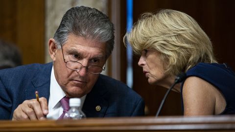 Sens. Joe Manchin, a Democrat from West Virginia, at left, speaks with Sen. Lisa Murkowski, a Republican from Alaska, during a hearing on Capitol Hill in Washington, in July 2021. 