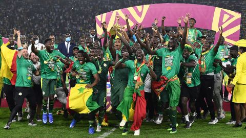 Senegal's players celebrate with the trophy after winning the Africa Cup of Nations match against Egypt on February 6, 2022.