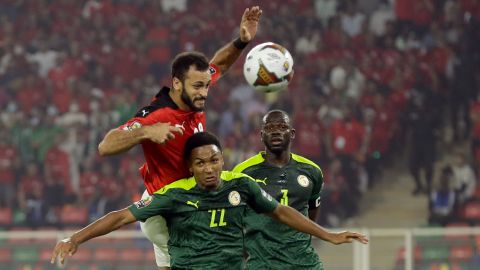 Egypt's Marwan Hamdi, top, jumps for the ball with Senegal's Abdou Diallo during the African Cup of Nations 2022 final soccer match on Sunday, February 6, 2022.
