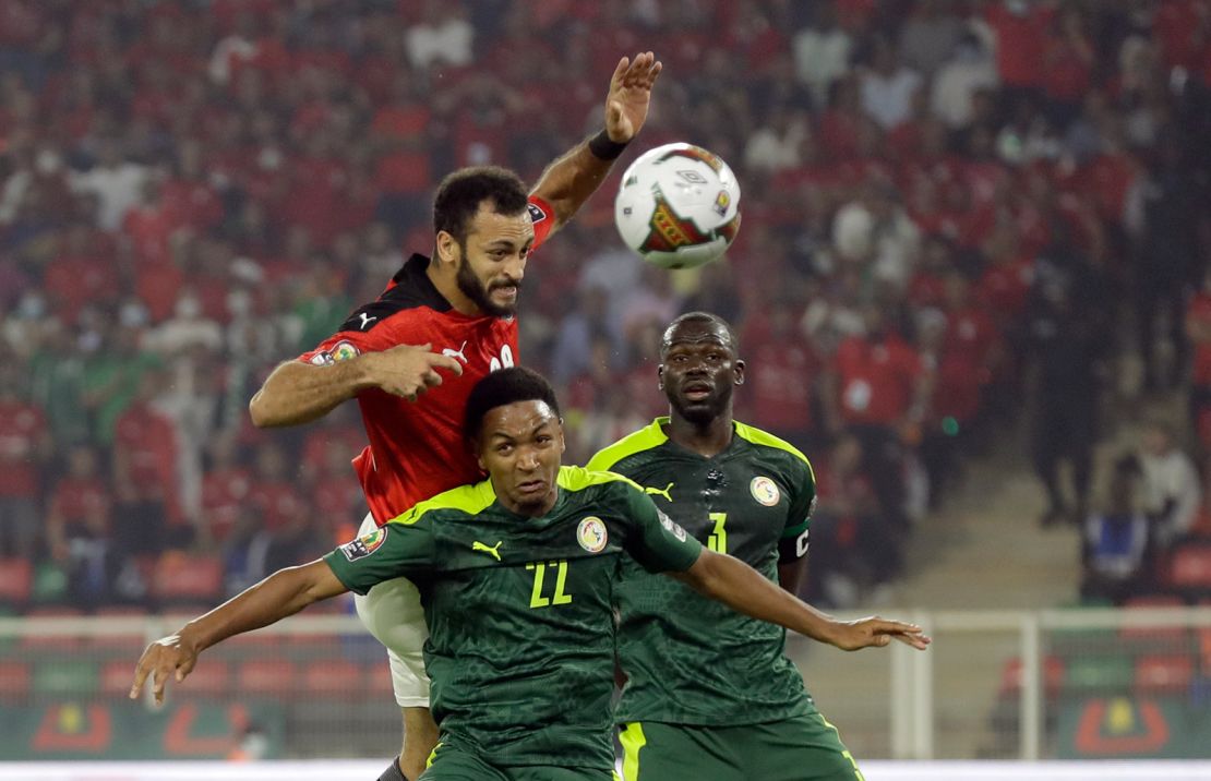 Egypt's Marwan Hamdi, top, jumps for the ball with Senegal's Abdou Diallo during the African Cup of Nations 2022 final soccer match on Sunday, February 6, 2022.
