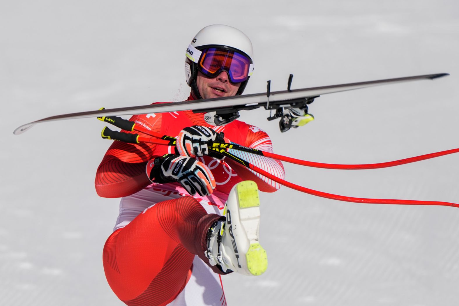 Switzerland's Beat Feuz kicks one of his skis in the air after finishing his downhill run on February 7. <a href="index.php?page=&url=https%3A%2F%2Fwww.cnn.com%2Fworld%2Flive-news%2Fbeijing-winter-olympics-02-07-22-spt%2Fh_d46db07dcb6fd0da2df77364921d6237" target="_blank">He won the gold,</a> Switzerland's first in these Olympics. Feuz won a silver and a bronze at the 2018 Winter Games.